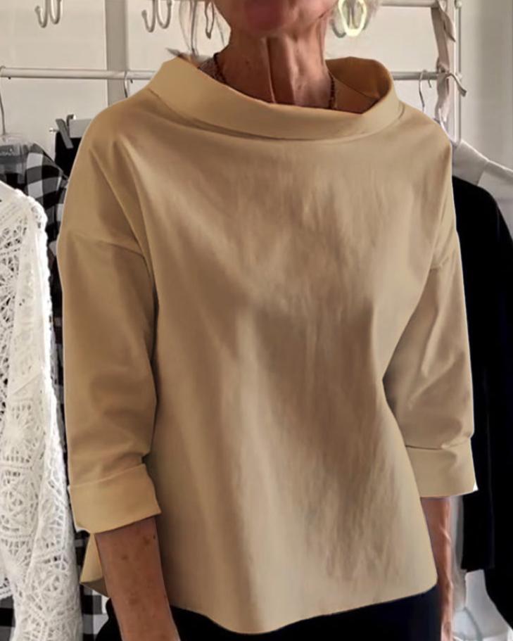 Stylowy damski top z eleganckim wysokim kołnierzem