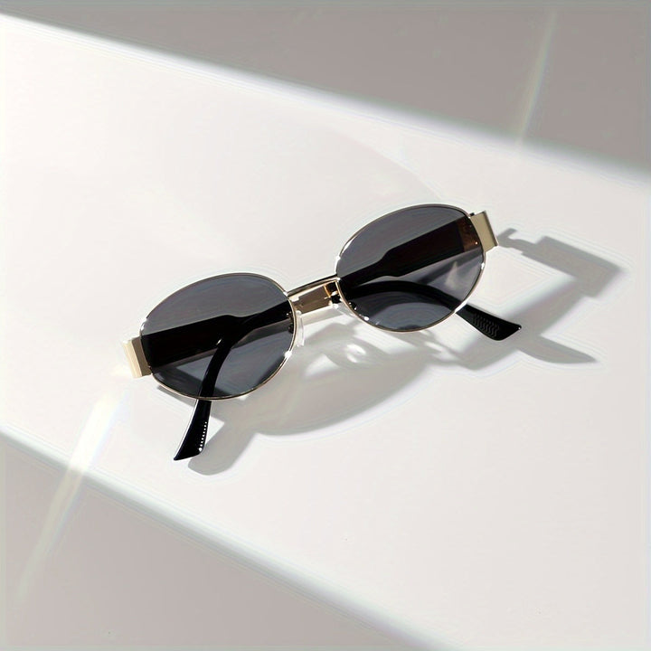 Majella | Elegante Ovale Zonnebril met Luxe Gouden Frame voor een Tijdloze Look