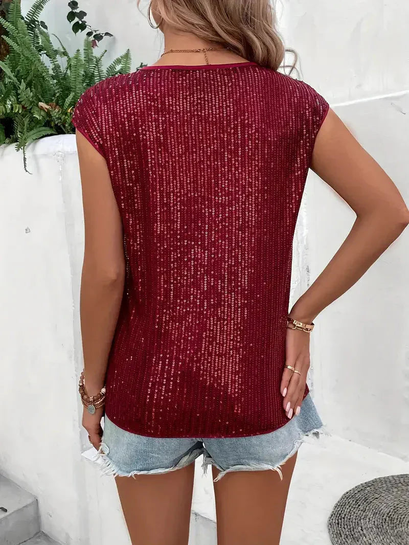 Elegancka brokatowa bluzka damska - stylowy wygląd na każdą okazję