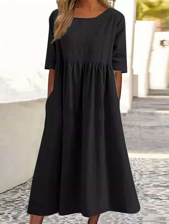 Silvia™ - Elegancka bawełniana sukienka z okrągłym dekoltem i wygodnymi kieszeniami