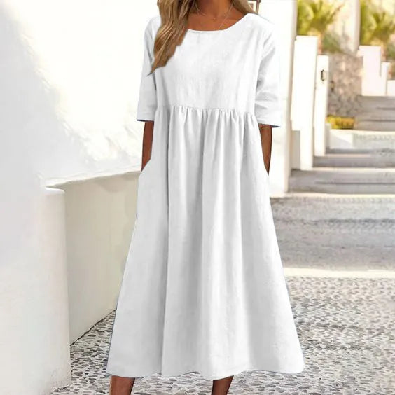 Silvia™ - Elegancka bawełniana sukienka z okrągłym dekoltem i wygodnymi kieszeniami