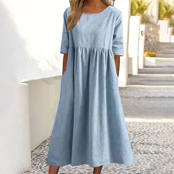 Silvia™ - Elegancka bawełniana sukienka z okrągłym dekoltem i wygodnymi kieszeniami