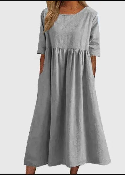 Silvia™ - Elegancka bawełniana sukienka z okrągłym dekoltem i wygodnymi kieszeniami