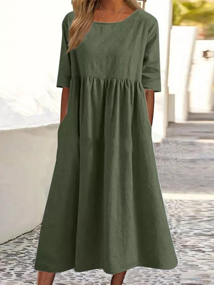 Silvia™ - Elegancka bawełniana sukienka z okrągłym dekoltem i wygodnymi kieszeniami