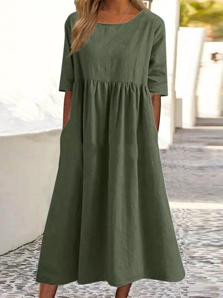Silvia™ - Elegancka bawełniana sukienka z okrągłym dekoltem i wygodnymi kieszeniami
